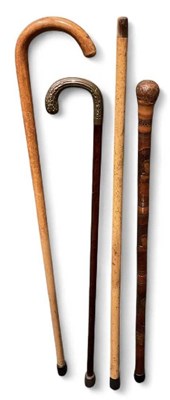 Lot 297 - A collection of four assorted walking sticks...