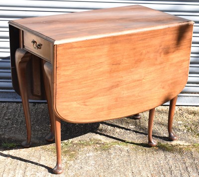 Lot 47 - A 20th century mahogany drop-leaf dining table...