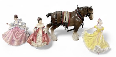Lot 561 - ROYAL DOULTON; three porcelain figures of...