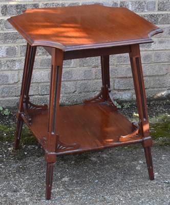 Lot 35 - An Edwardian two tier table with shaped top,...