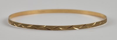 Lot 1466 - A 9ct yellow gold bangle, diameter 7cm, approx...