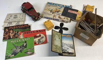 Lot 207 - MECCANO; a small amount of Meccano pieces, a...
