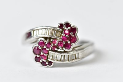 Lot 1126 - A platinum ring set with baguette diamonds and...