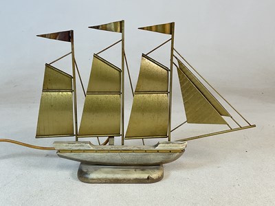 Lot 838 - A mid 20th century wood and brass table lamp...