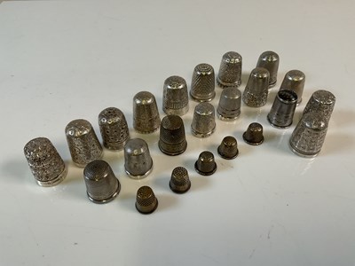 Lot 616 - A group of thimbles comprising ten silver...
