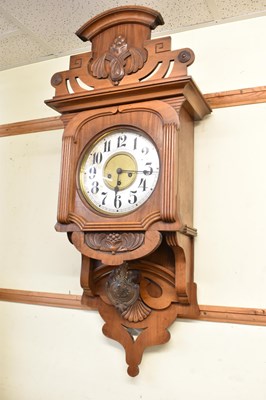 Lot 110 - A Victorian carved walnut wall clock with...