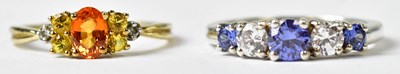 Lot 1170 - A 9ct yellow gold ring set with a central oval...