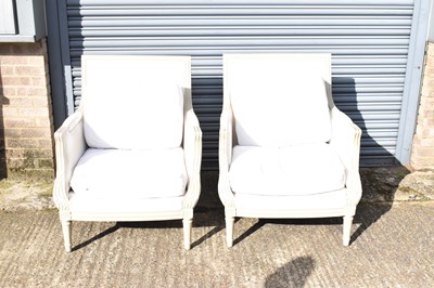 Lot 29 - A pair of modern French style cream painted...