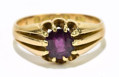 Lot 1062 - An 18ct yellow gold and ruby solitaire ring,...
