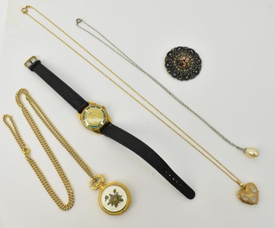 Lot 1350 - A 9ct gold heart shaped double locket with...