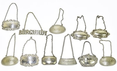 Lot 2505 - Two Elizabeth II hallmarked silver bottle...