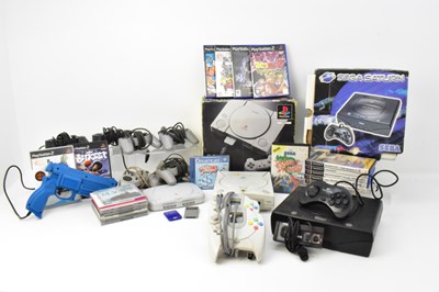 Lot 739 - Various Sega and Sony vintage game consoles,...