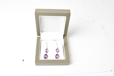Lot 1305 - A pair of 9ct yellow gold amethyst double drop...