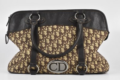 Lot 163 - CHRISTIAN DIOR; a tan and brown cloth and...