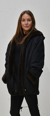 Lot 218 - RAMOSPORT; a black polyester blend short...