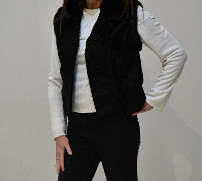 Lot 217 - DEANFIELD, LONDON; a black short astrakhan fur...