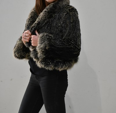 Lot 342 - CAROLE, PARIS; a short black and tan unlined...