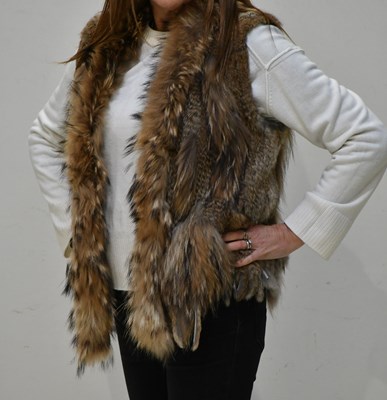 Lot 343 - A short fox and rabbit fur gilet, lined with...