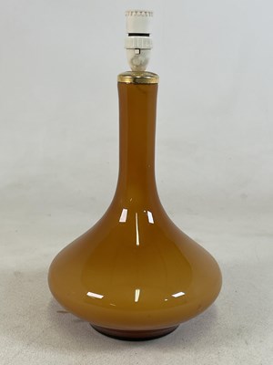 Lot 840 - A mid 20th century amber cased glass table...