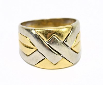 Lot 1063 - An 18ct yellow and white gold broad ring, size...