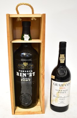 Lot 235 - Two bottles of port, comprising a wooden cased...