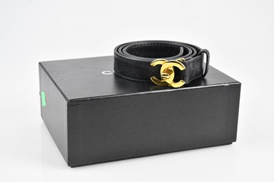 Lot 68 - CHANEL; a black textured leather lady's narrow...