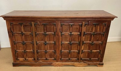 Lot 893 - A teak sideboard, with embellished metal...