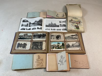 Lot 59 - An oblong photograph album with approximately...