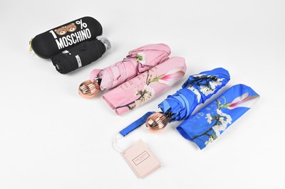 Lot 128 - TED BAKER; a bright blue floral umbrella with...