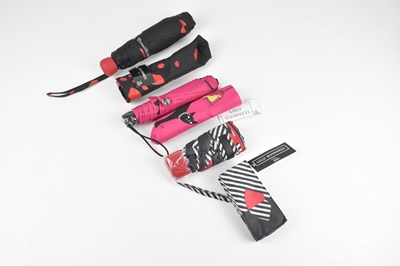 Lot 130 - LULU GUINNESS; three small umbrellas, two with...