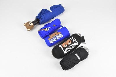 Lot 132 - MOSCHINO; three small umbrellas comprising an...