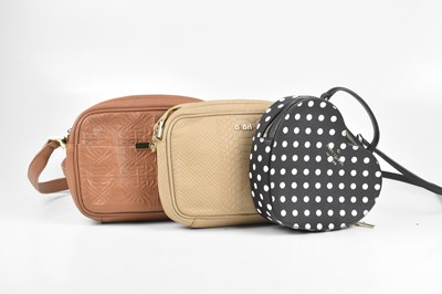 Lot 381 - KATE SPADE; a black heart shaped crossbody...