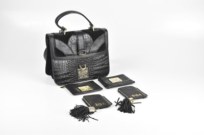 Lot 147 - BIBA; a black embossed leather handbag, with...