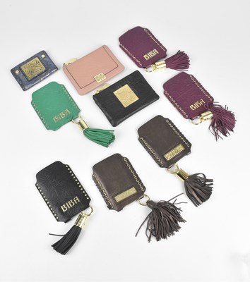 Lot 145 - BIBA; a black embossed leather purse with gold...