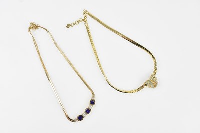 Lot 239 - CHRISTIAN DIOR; a gold tone flat chain...
