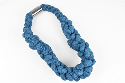 Lot 386 - EMPORIO ARMANI; an unusual teal blue wool...