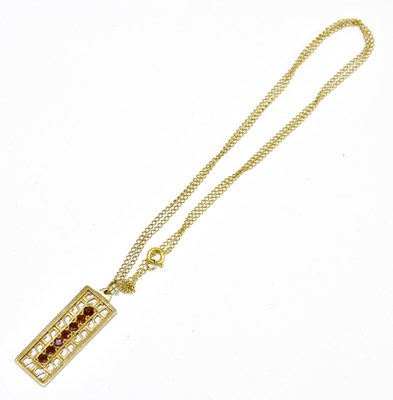 Lot 242 - A 9ct yellow gold pierced rectangular pendant...