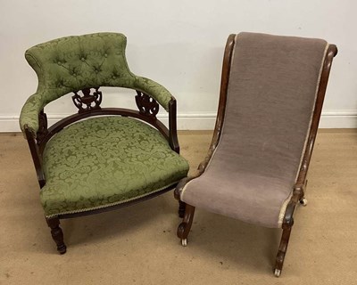 Lot 947 - An oak upholstered low chair with carved urn...