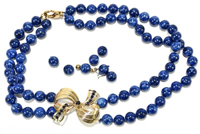 Lot 1338 - A lapis lazuli bead necklace with 18ct yellow...
