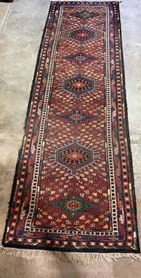 Lot 845 - A hand woven Middle Eastern style runner, 330...