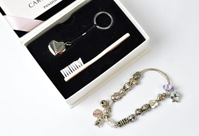 Lot 1211 - PANDORA; a 925 silver snake chain bracelet set...