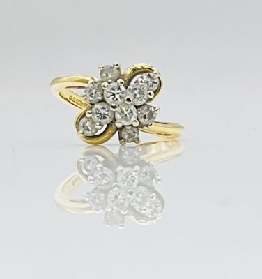Lot 671 - An 18ct yellow gold diamond floral cluster...