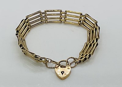 Lot 679 - A 9ct yellow gold four bar gate link bracelet...