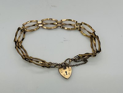 Lot 746 - A 9ct yellow gold three bar gate link bracelet,...