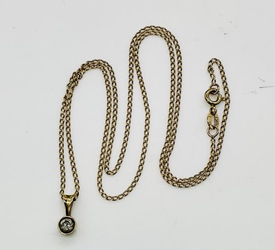 Lot 745 - A 9ct yellow gold diamond pendant, the collet...