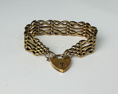 Lot 682 - A 9ct gold gate link bracelet, length approx...