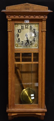 Lot 142 - An early 20th century oak cased twin-weight...