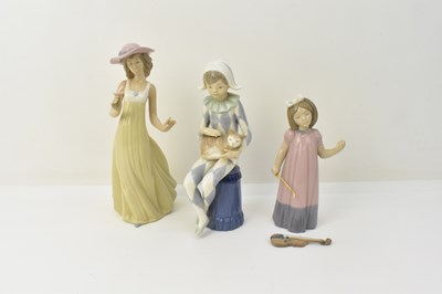Lot 164 - NAO; three high glazed porcelain figures...