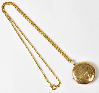 Lot 1251 - A 9ct yellow gold circular locket with foliate...
