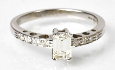 Lot 1150 - An 18ct white gold ring set with baguette cut...